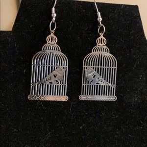 Metal laser cut bird in a cage